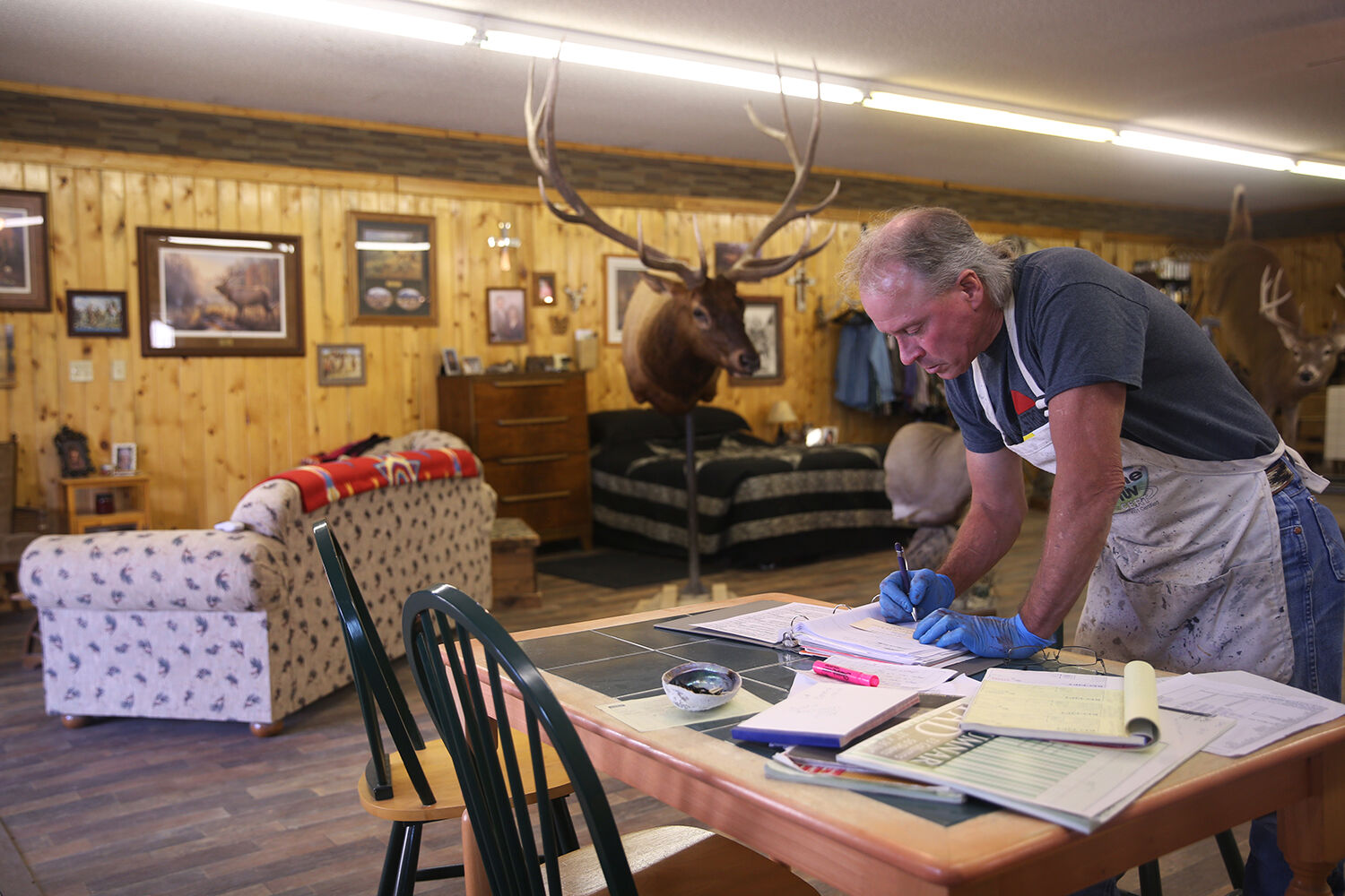 Tim moves from his back work table to his kitchen table
